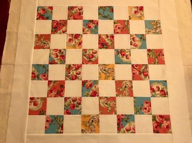 rosy four patch baby quilt